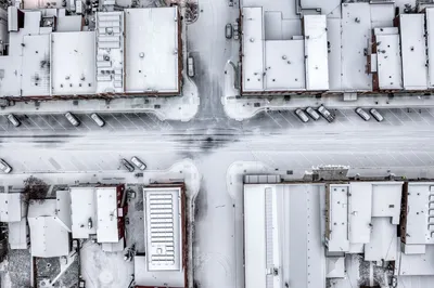 Aerial view of snow-covered streets and buildings in a wintery urban setting in Wabasha, MN.
