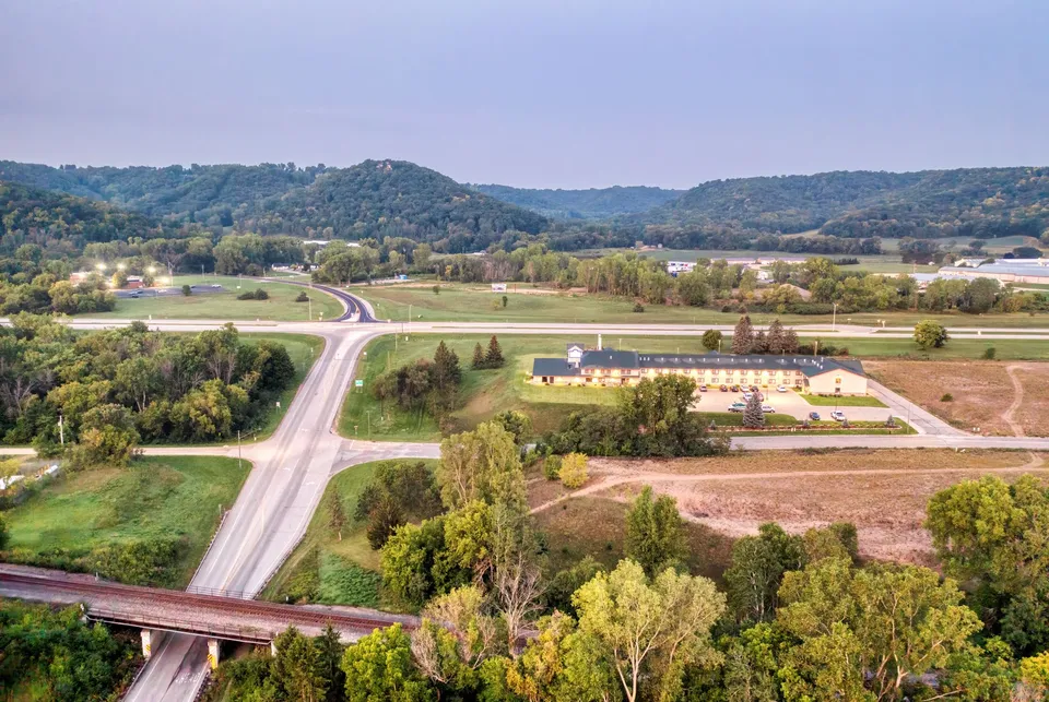 Aerial view of Wabasha's rural landscape with roads and lush greenery.